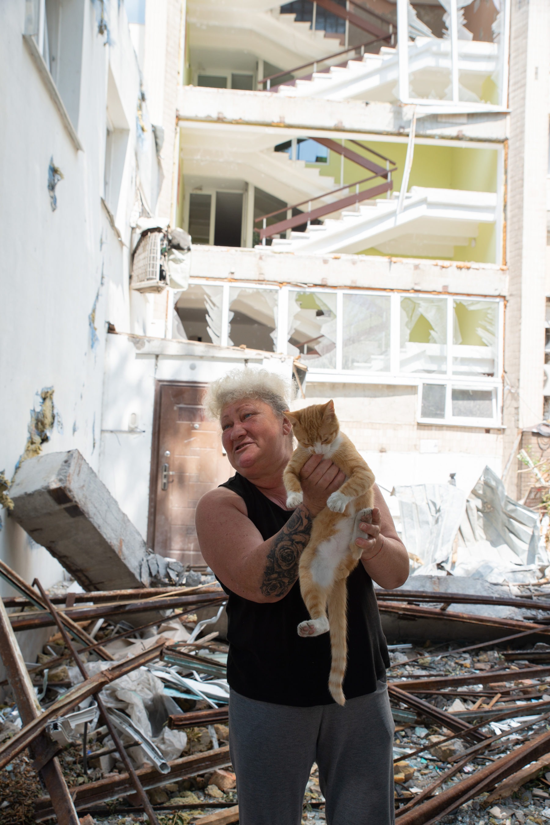 ukraine-woman-and-her-cat-in-a-destroyed-building